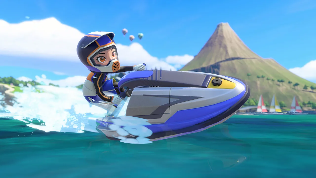 Sportsmate riding a jet ski in Power Cruising with the island volcano behind