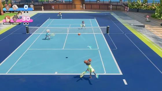 Tennis match on a blue hard court